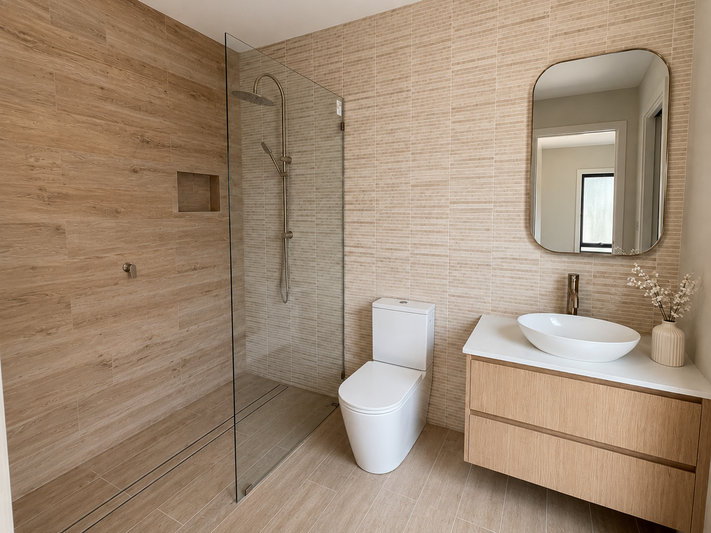 Finished neutral bathroom renovation with walk-in shower and wood floating vanity