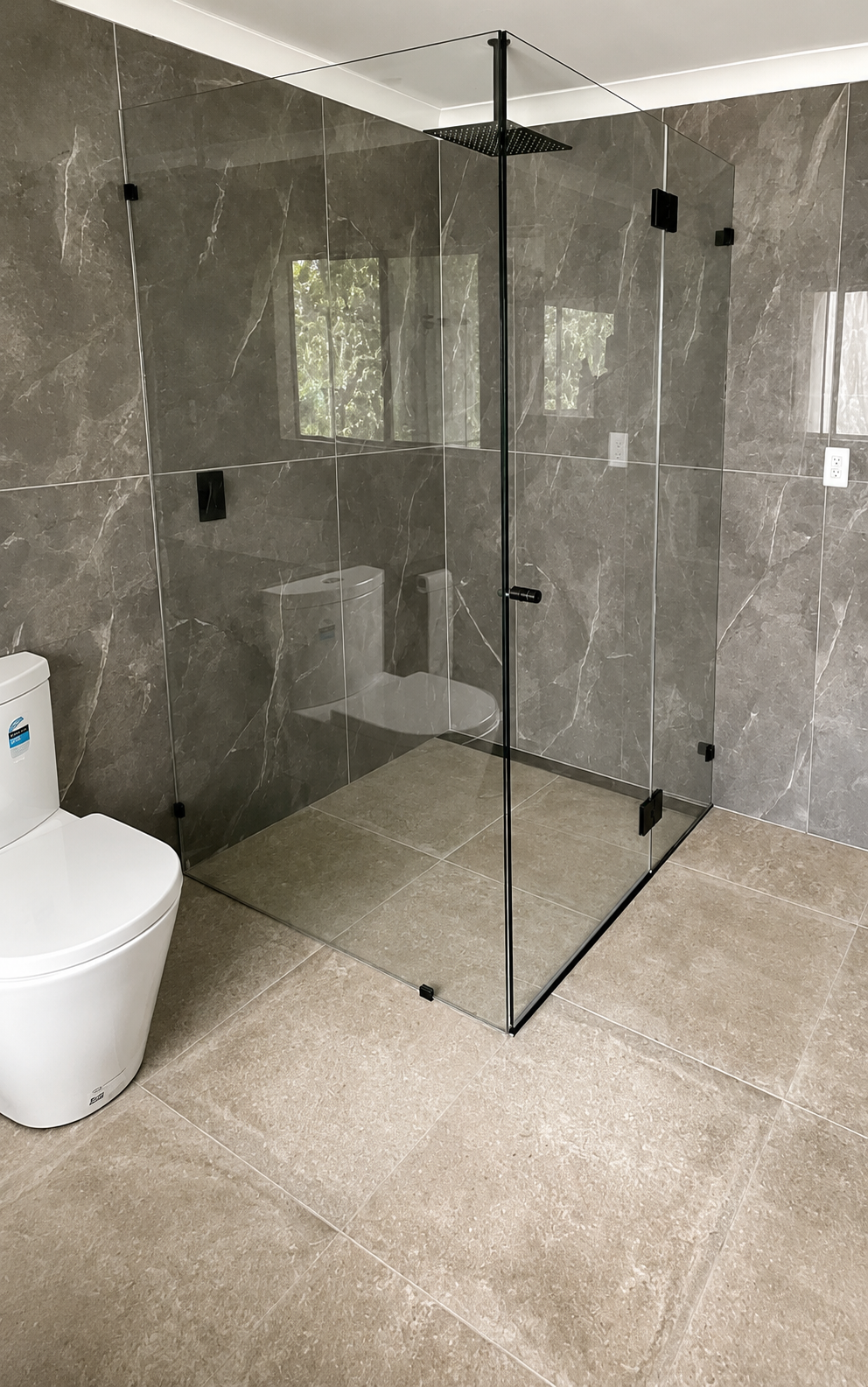 Completed main waterfall shower with glass frame