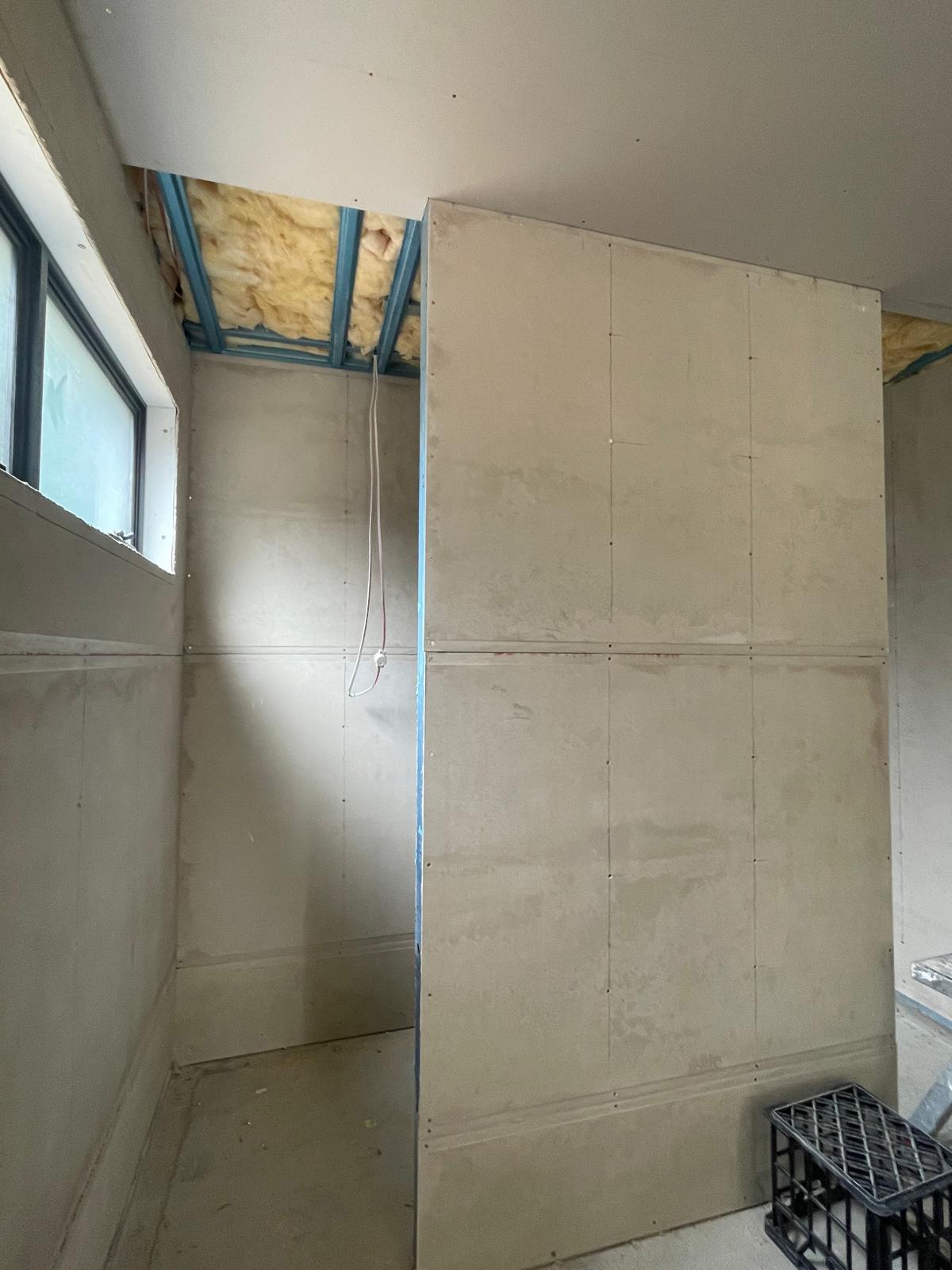 Travertine main bathroom tiling before