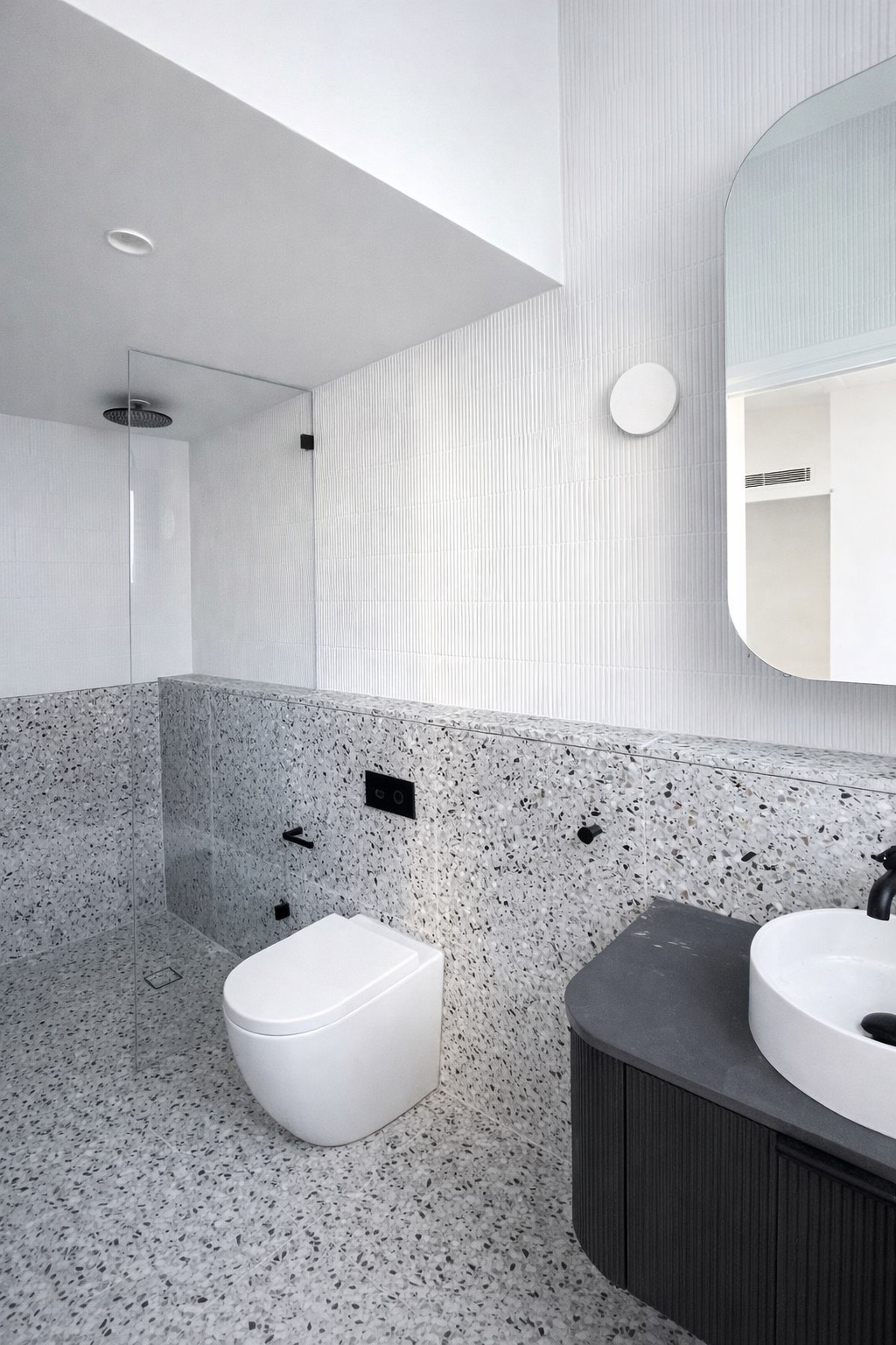 Completed ensuite bathroom with terrazzo and pencil trim tiles