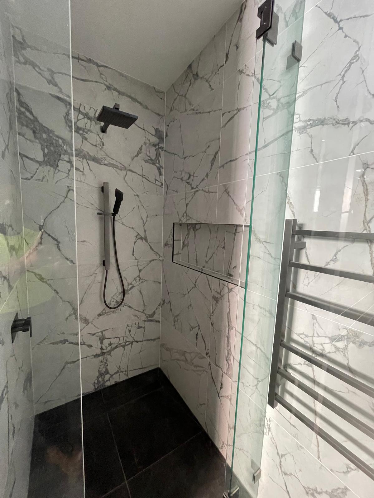 Completed ensuite main waterfall shower with linear floor drain