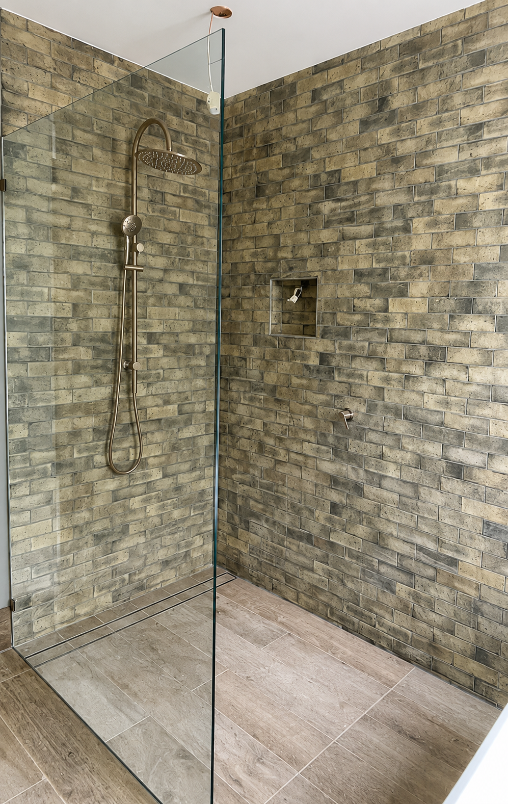Completed neutral main bathroom walk-in waterfall shower