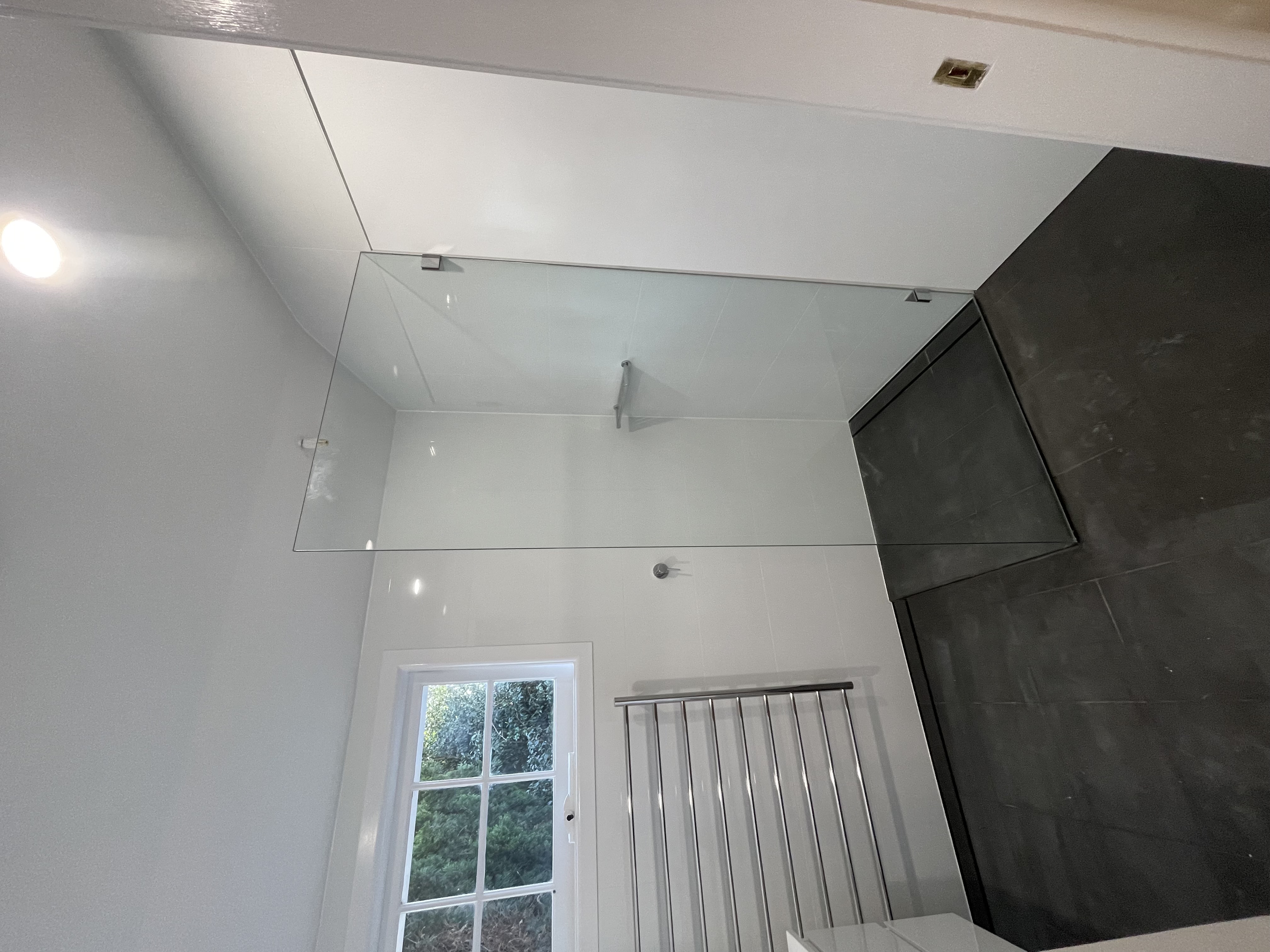 Completed small white ensuite shower