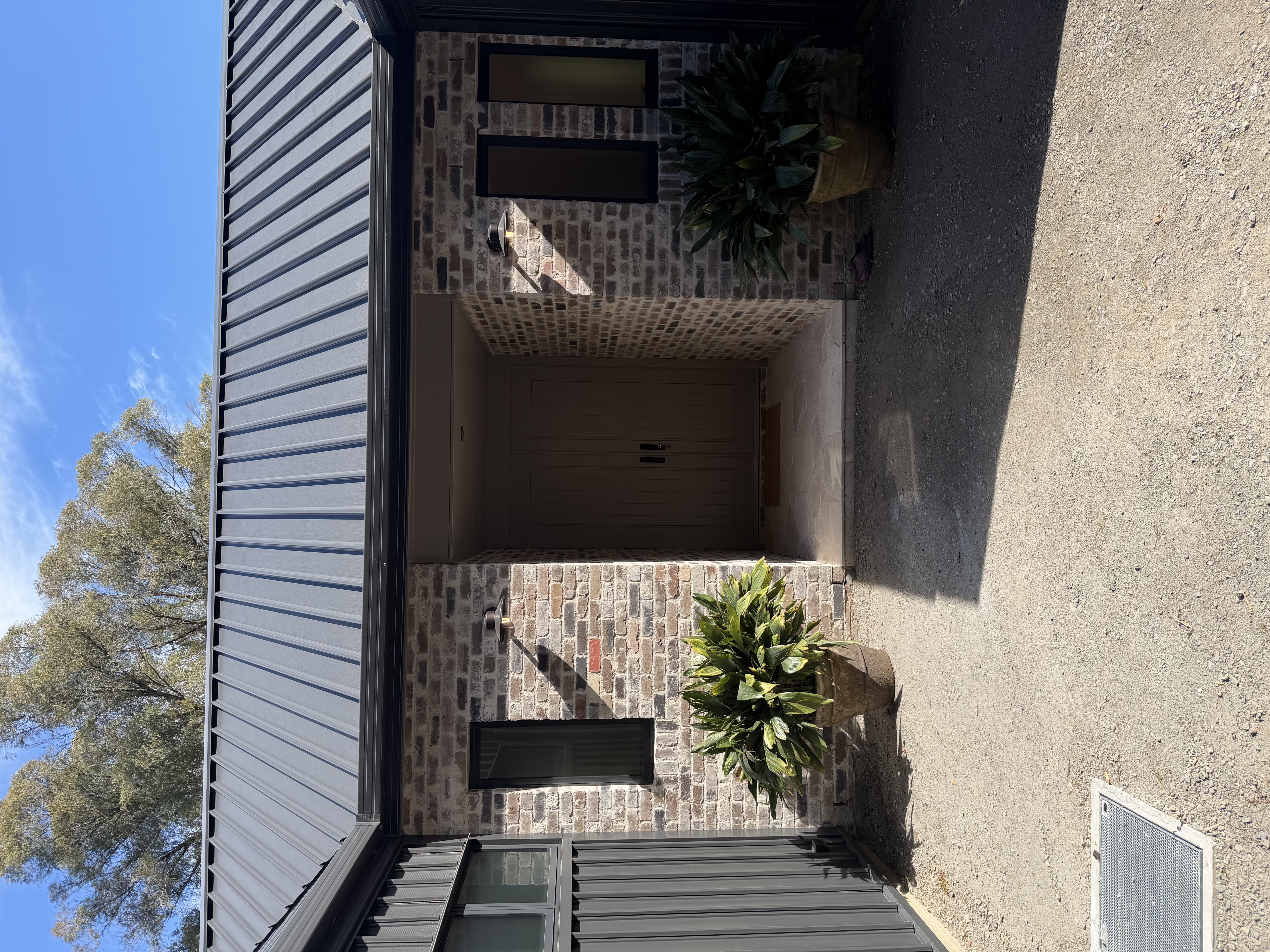Completed exterior entry with landscaping