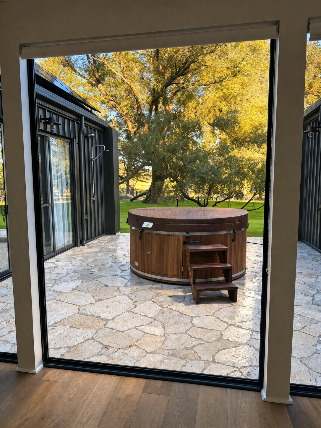 Completed patio renovation with hot tub at golden hour