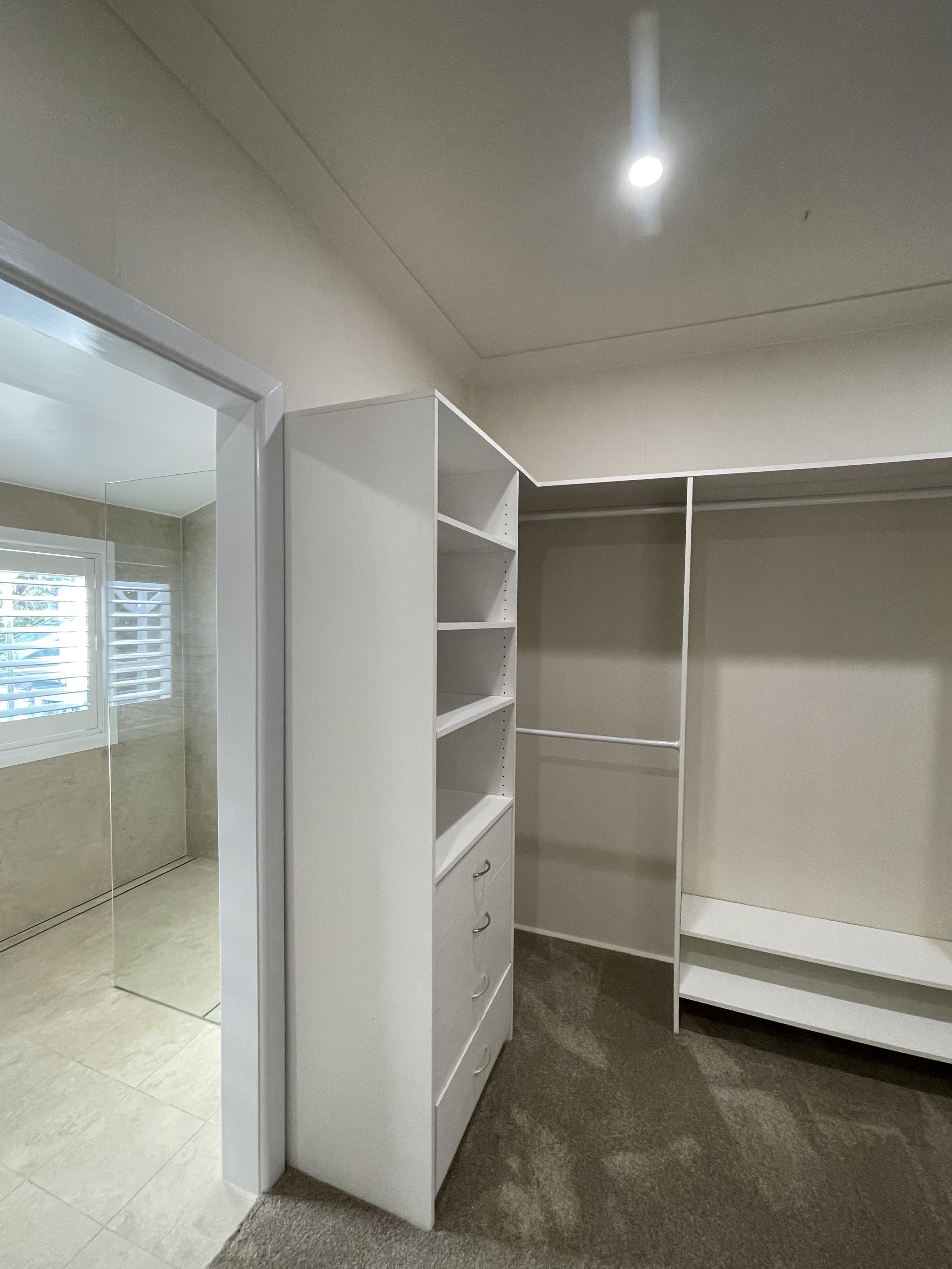 Completed main bedroom custom walk-in wardrobe