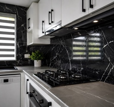 Completed kitchen with black marble-look splashback and white wall-hung pantry