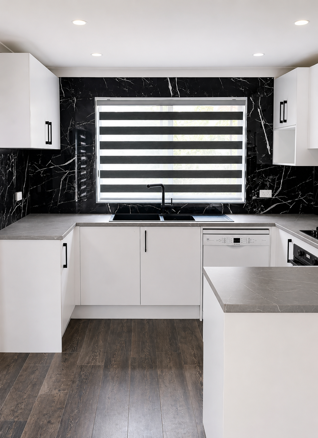 Completed full kitchen with black marble-look splashback and white wall-hung pantry