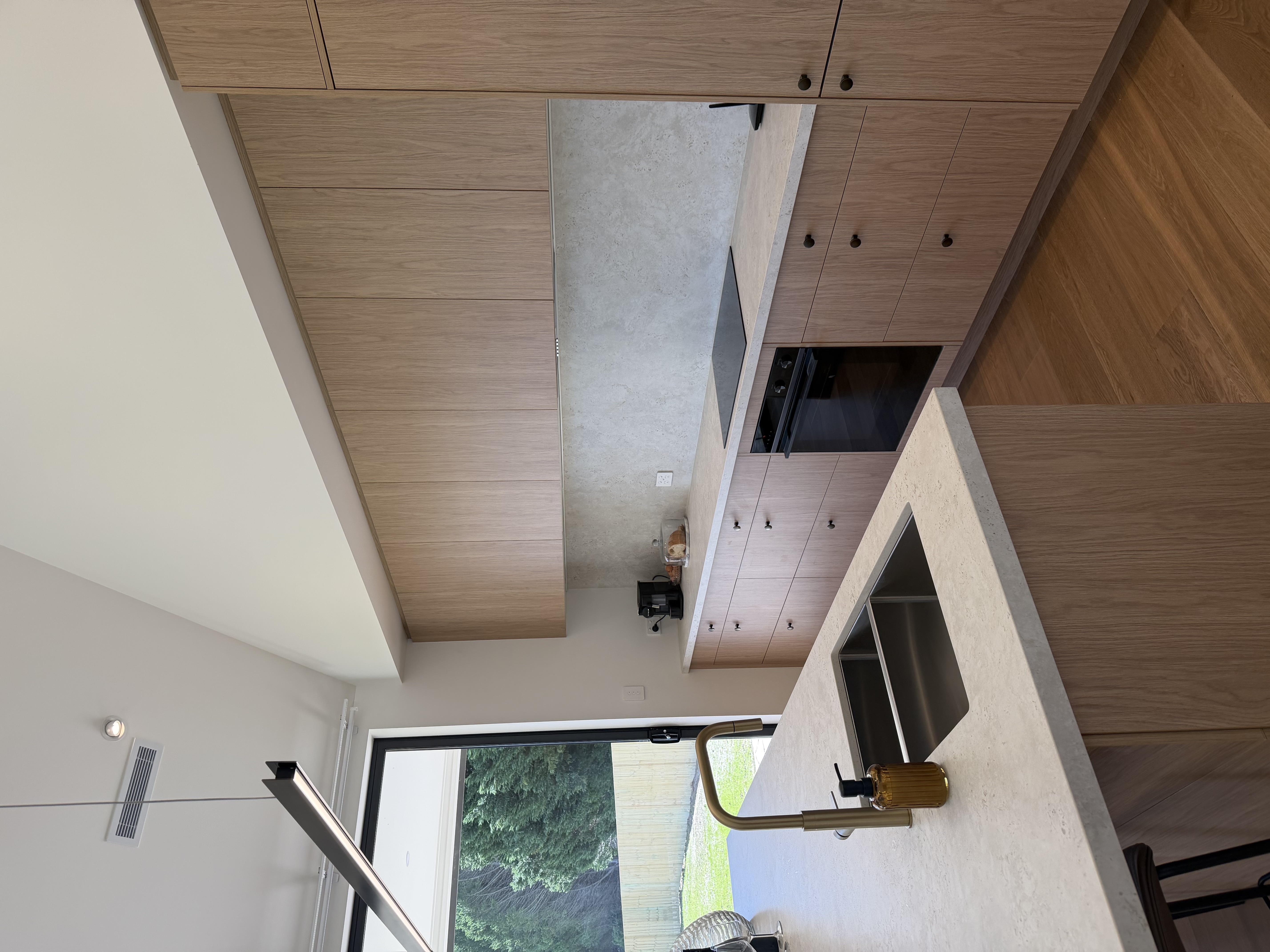 Completed wood kitchen with island cabinetry