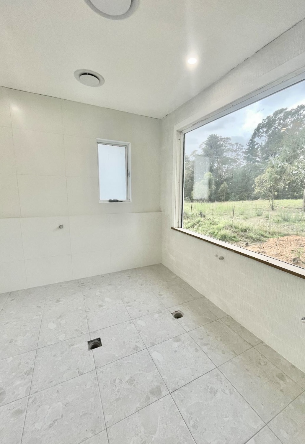Farmhouse main bathroom tiling after